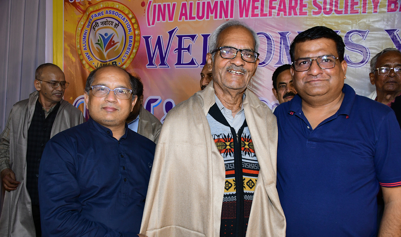Alumni gathering in a modern auditorium hall